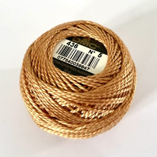 A DMC Cotton Perle 116 / 436 / 8 (Light Brown) ball of 100%, mercerised cotton thread that has been manufactured using a twisting process so it iis non-divisible.