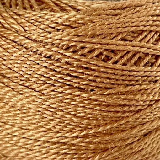 A DMC Cotton Perle 116 / 436 / 8 (Light Brown) ball of 100%, mercerised cotton thread that has been manufactured using a twisting process so it iis non-divisible.
