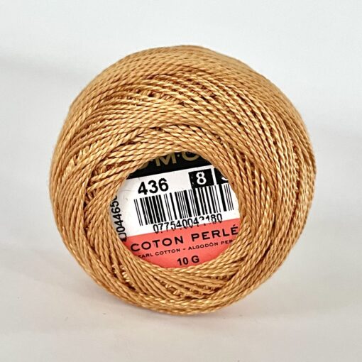 A DMC Cotton Perle 116 / 436 / 8 (Light Brown) ball of 100%, mercerised cotton thread that has been manufactured using a twisting process so it iis non-divisible.