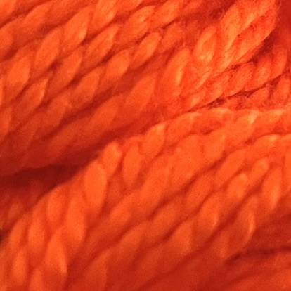 A DMC Cotton Perle in shade 608 (size 3) skein of 100%, mercerised cotton embroidery thread manufactured using a twisting process so it is non-divisible.