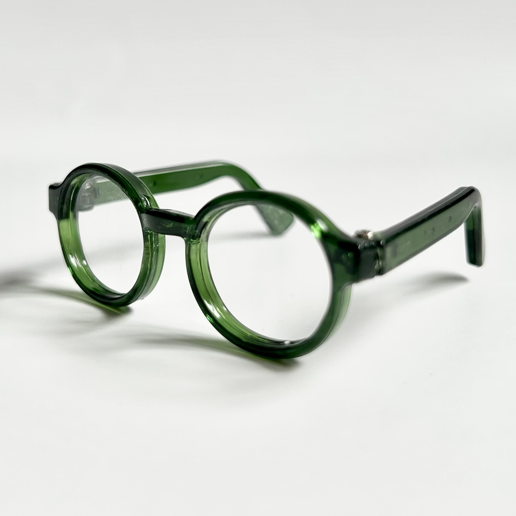 green miniature toy glasses for bears and dolls